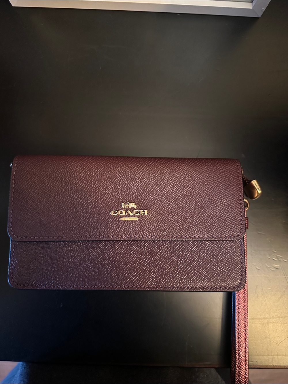 Coach Pebbled Leather Wristlet in Deep Plum with Gold Logo